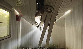 Collapsed interior ceiling caused by roof damage and water intrusion